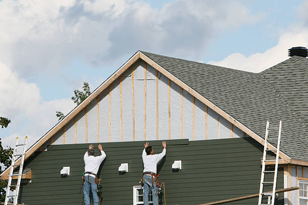 Professional Siding Contractor technician working in Millis, MA
